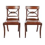 A PAIR OF REGENCY MAHOGANY SIDE CHAIRS, CIRCA 1820 The curved crest rail... A PAIR OF REGENCY