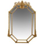 A 19thCENTURY OCTAGONAL GILT GESSO WALL MIRROR The moulded gilt gesso... A 19thCENTURY OCTAGONAL