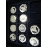 China Silver Pandas (10) a a date run from 1999 - 2008, all BU in plastic capsules housed in a "
