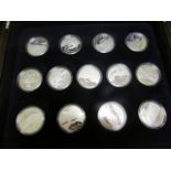 World Silver Proofs (12) All Crown size and housed in a plush box with each coin depicting different