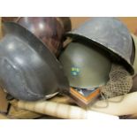 Militaria - large box packed with various Military Helmets, belts, webbing, hand cuffs, etc etc etc.