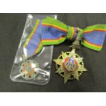 Thailand Order of the Crown Lady Commanders bow mounted badge and a smaller medal, both silver ?