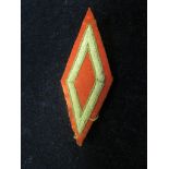 Cloth military badge, Victorian ?, diamond shaped with red back ground, unidentified