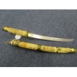 Japanese knife with curved bone grips and scabbard. Blade 11". Decorative tourist type. Overall good