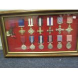 Frame of Replica British Gallantry Medals from the Victoria Cross on (14) Buyer collects