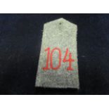 Imperial German field grey epaulette no '104' in red