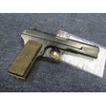 Pistol: A Russian WW2 Tokarev Semi Automatic pistol, cal .7.62mm. and dated 1944. Plain chequered