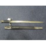 Bayonet: Pattern 1887 MKIII sword bayonet for the Martini - Henry Rifle. In its steel mounted