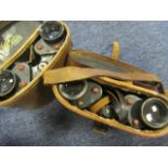 Binoculars two pairs of WW2 examples both in excellent condition in their brown leather cases