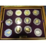 Queen Elizabeth II Golden Jubilee Collection a 24 coin set of Silver Crown sized coins from around