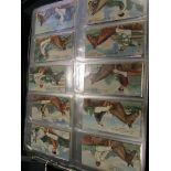 Album containing 19 complete sets of cards, 2 sets from Anstie (Racing Series 1-25 & 26-50) & 17