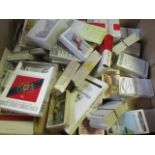 Box containing approx 46 apparently complete sets of cards in packets & bundles, sets include