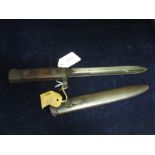 Bayonet: Italian Model 1938 Carcano knife bayonet in its steel scabbard. Sound condition overall.