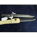 Bayonet: British LIA 4 (commercial) unmarked. Bowie blade 8". Metal grip. In its steel scabbard with