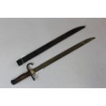 Bayonet: A Japanese Arisaka Model 1897 bayonet with hooked quillon. In its metal scabbard (