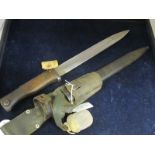 Bayonet: An Imperial German Model 1884/98 knife bayonet with wooden grips and flashguard made by