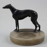 1930's desktop stand of a greyhound on an alabaster base, the dog being made of spelter