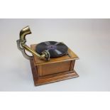 The Palladium gramophone, with a later large brass horn, oak cased