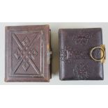 Two small sized edwardian leather embossed photo albums both full of images