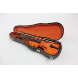 Miniature wooden violin and bow in fitted case approx 22.5 cm long.