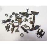 Mixed artifacts, to include Roman brooches, a phallic brooch, Roman 3rd Century bronze eagle,