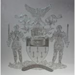 Modern etched glass window, etched with a coat of arms of two armoured Knights flanking a shield