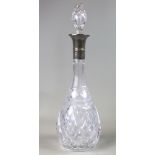 Silver rimmed teardrop decanter with cut glass body. original stopper and standing 39.5 cm makers