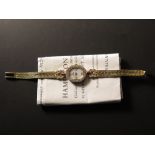 Ladies 18ct gold Omega quartz wristwatch. Mother of pearl dial with four diamonds set at 12, 3,