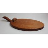 Robert "Mouseman" Thompson Oak Cheeseboard circa 1930s/40s, the oval board with carved mouse