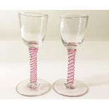 Glass - small Cordial ? Glasses - coloured pinkish and white Twist Stems (one chip on base)  (2)