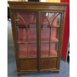 Circa 1900 Art Nouveau display cabinet with two glazed doors and shaped panes to the front