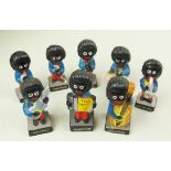 Eight ceramic vintage Robertsons "Golly" figures painted and representing a band.