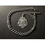 Edwardian hallmarked silver "T" bar pocket watch chain with a silver fob attached, approx length