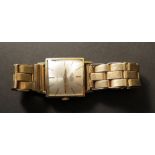 A gentlemans 9ct gold square faced "Trebex" wirstwatch on a 9ct gold expandable bracelet, total