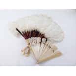 A faux ivory fan and another from faux tortoiseshell & ostrich feathers, both circa 1920