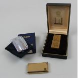 A cased Dunhill and Ronson lighter and a loose Calibri lighter