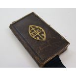 Exquisite miniature cope of the common book of prayer printed in London 1855. Leather bound but with