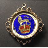 Enamelled Silver Shilling dated 1911 in a 9ct gold ornate mount