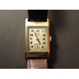 A gentleman's 1930s Tissot gold cased wristwatch, bearing Arabic numerals, subsidiary seconds dial