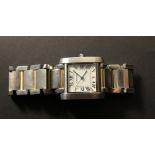 Cartier, "Tank" stainless steel gentleman`s wristwatch with date on a stainless steel Cartier