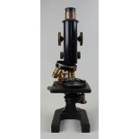 Mid 20th century scientific microscope by Beck of London. Rotating 3 lenses and adjustable platform