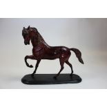 19th century Bronze horse mounted on a plinth in a trotting position. Stands 38 cm high