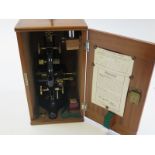 A mahogany cased W. R. Prior & Co microscope, height 33 cm, dated on the inside of the case February