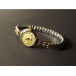 Tudor ladies 9ct gold wristwatch, attached to an expandable bracelet.