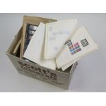 Box of many loose album pages with stamps, World range (qty) Buyer collects
