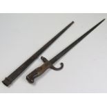 Bayonet: A French Model 1874 Gras Epee bayonet manufactured in June 1876. Worn and rusted overall in