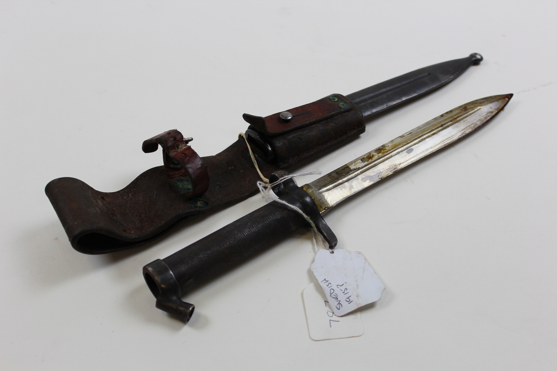 Bayonet: A good Swedish Model 1898 knife bayonet in its steel scabbard with original leather frog.