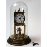 Early 20th century Brass Skeleton Clock with a four weighted pendulum and undere a glass dome.