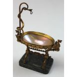 Regency period pocket watch stand in the form of a bath. Made from a mother of pearl shell with gilt