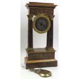 19th century mantle clock decorated in the classical manner with columns and extensive gilding